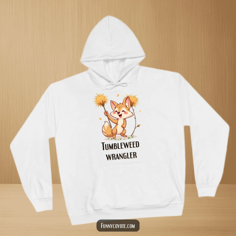 Funny Kawaii Coyote Hoodie featuring a cute coyote reaching for a tumbleweed, blending warmth with desert humor.